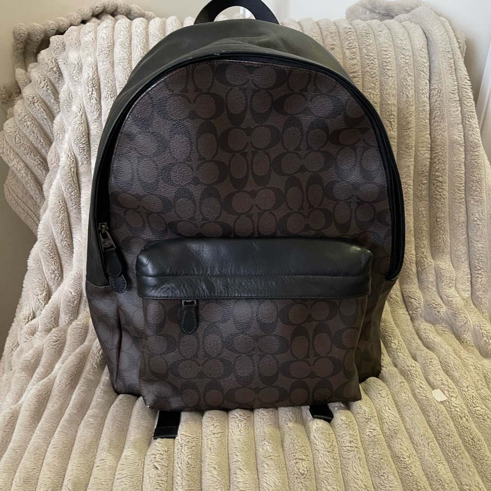 Coach Black and Brown Backpacks with Structured Shape and Zipper Closures